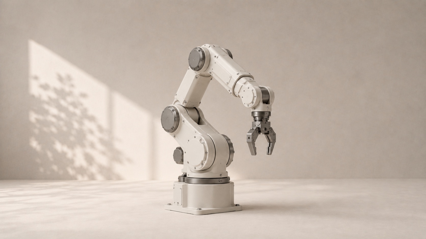 A six-axis industrial robot arm with a precision gripper.